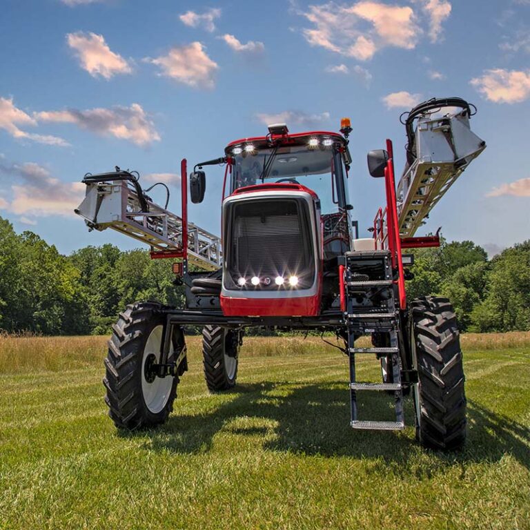 front of apache sprayer sitting in grass